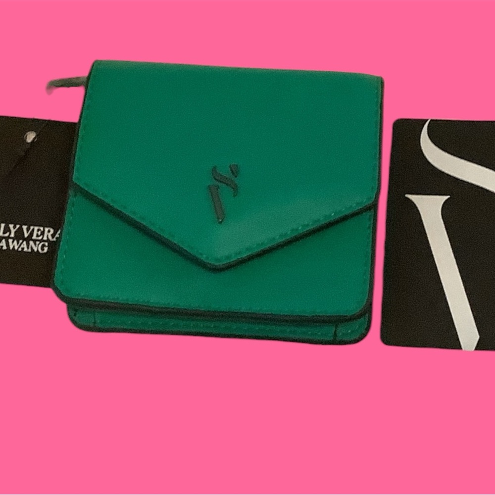 Vera Wang Baylor Flap wallet in emerald green features a envelope-style design.